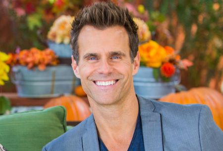 Cameron Mathison smiles at the camera.